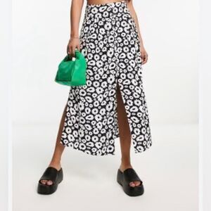 ASOS DESIGN button through midi skirt with split in mono daisy print